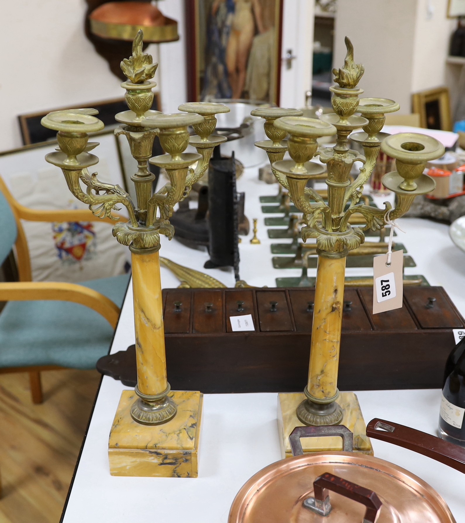 A pair of neoclassical style Sienna marble and brass candelabra, 51cm
